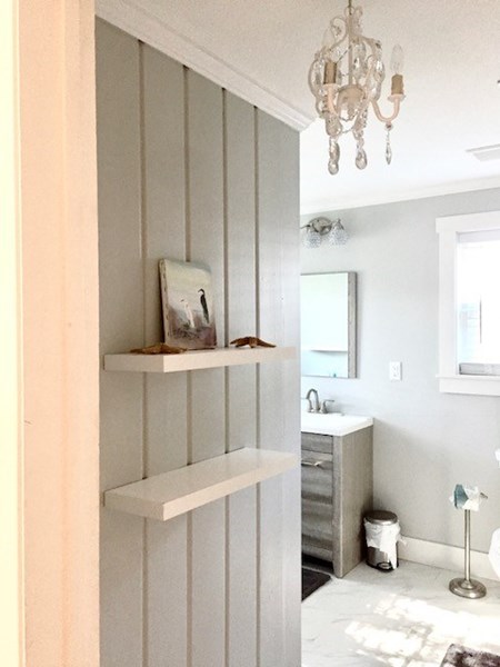 Master bath entrance with linen closet and shelves for storage