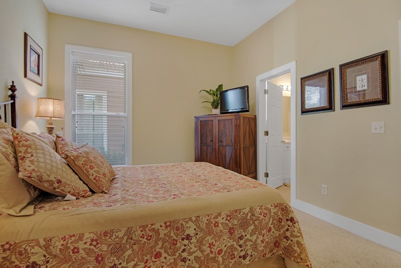 Downstairs bedroom has access to bath and features a queen bed plus 32 in flat screen tv