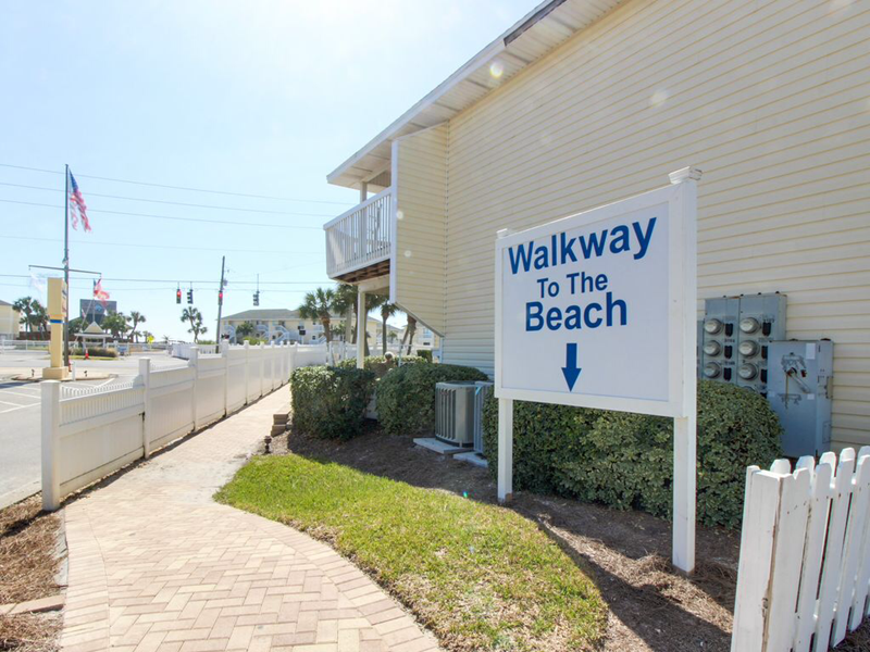 Short walk to beach or private parking if you want to drive