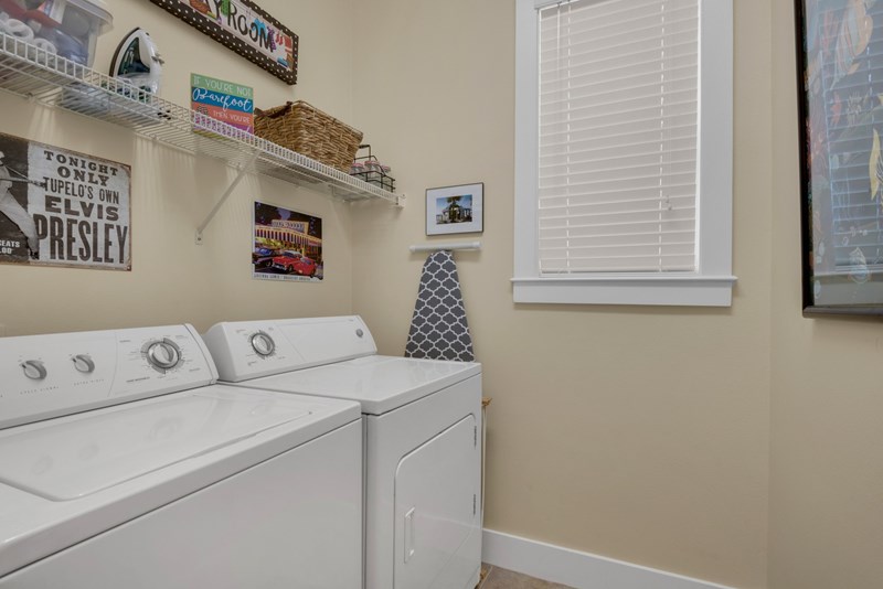 full size washer and dryer in laundry room