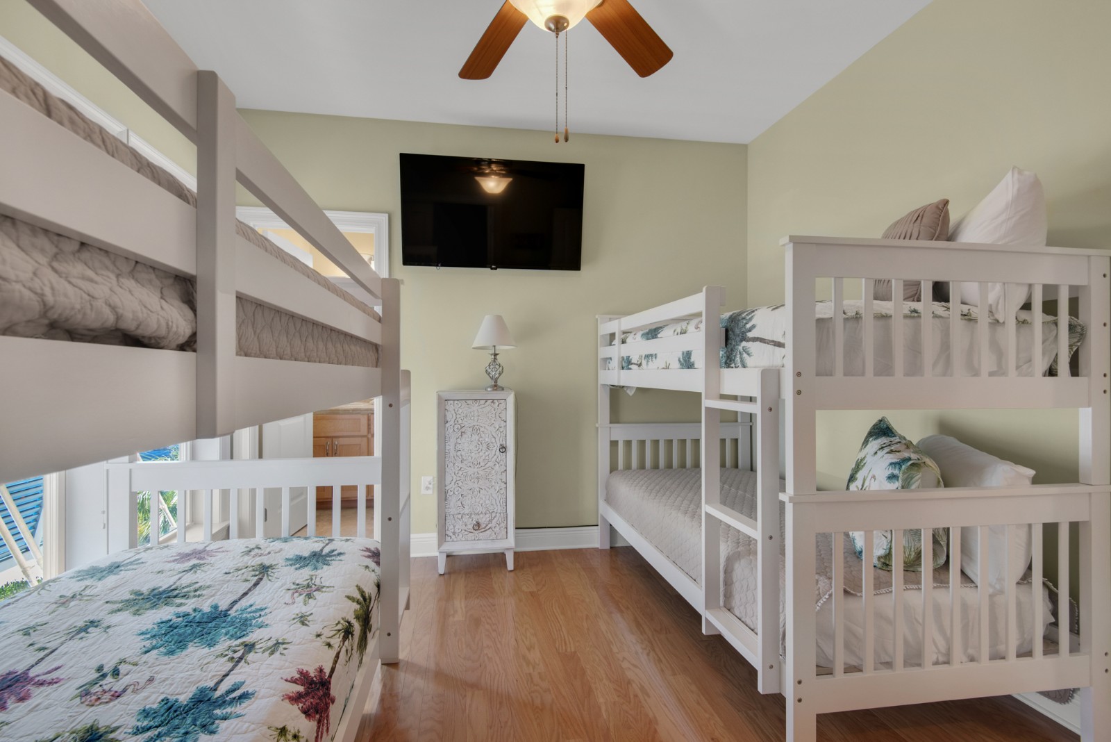 The third floor middle bedroom features two twin/twin bunks, 50