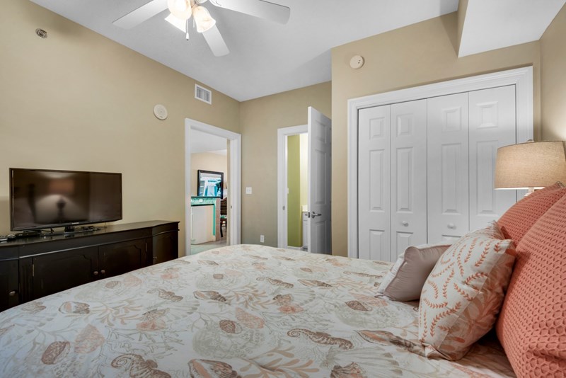 Guest bedroom has large flat screen tv and direct access to guest bath