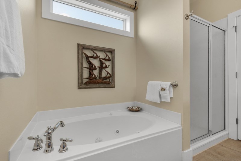 Master bath has jetted tub and separate shower