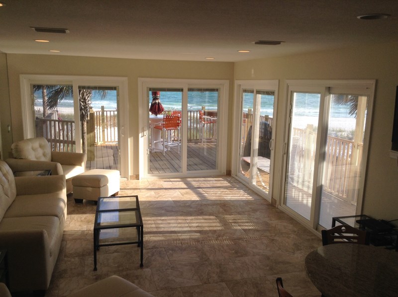 Living area looking at beach/corner villa doors on two sides