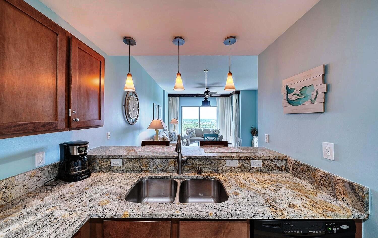 Granite counter tops and a kitchen with a view
