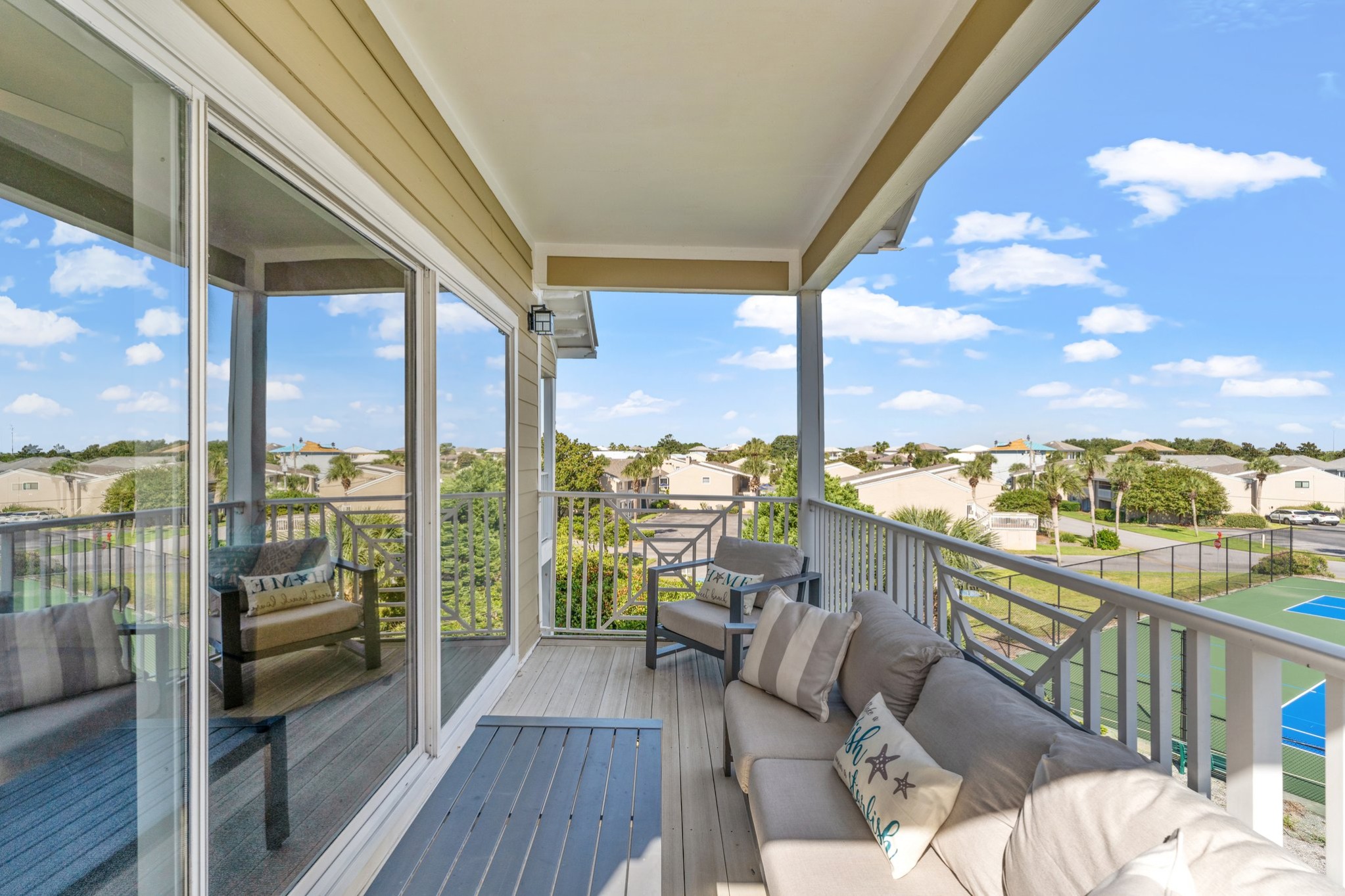 Master bedroom walk out private balcony with cozy patio furniture to enjoy stunning sunsets