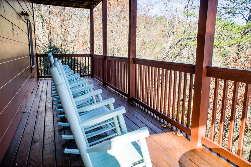 The lower level back deck has ten rocking chairs to enjoy the “Tranquil Times”