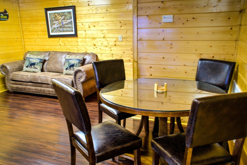 The game room has a large table for dining or games or laptops.