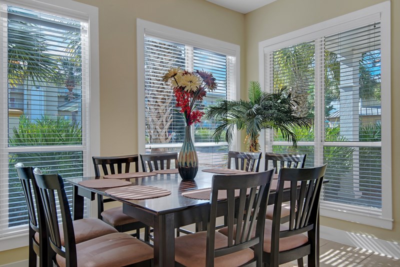 Dining area features a gathering table that accommodates 8!