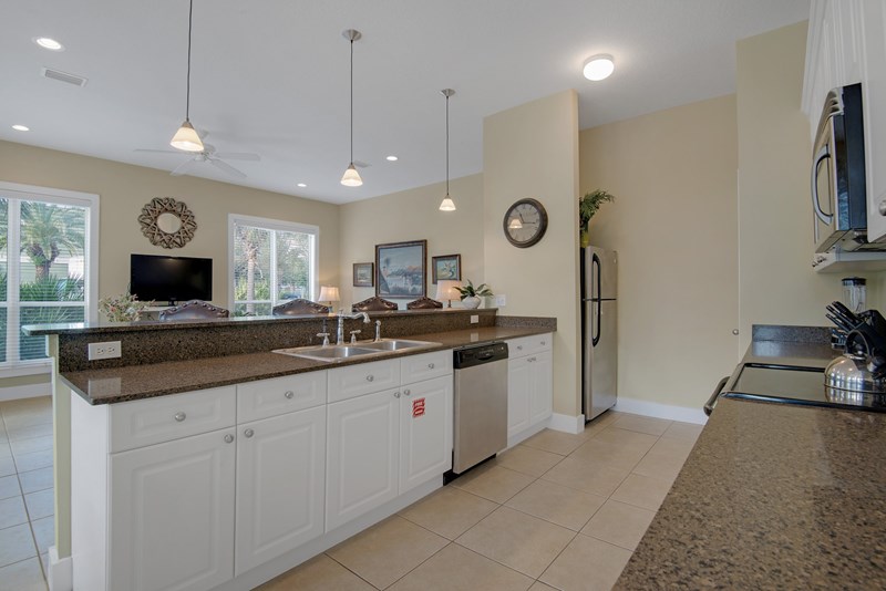 open concept kitchen features granite countertops