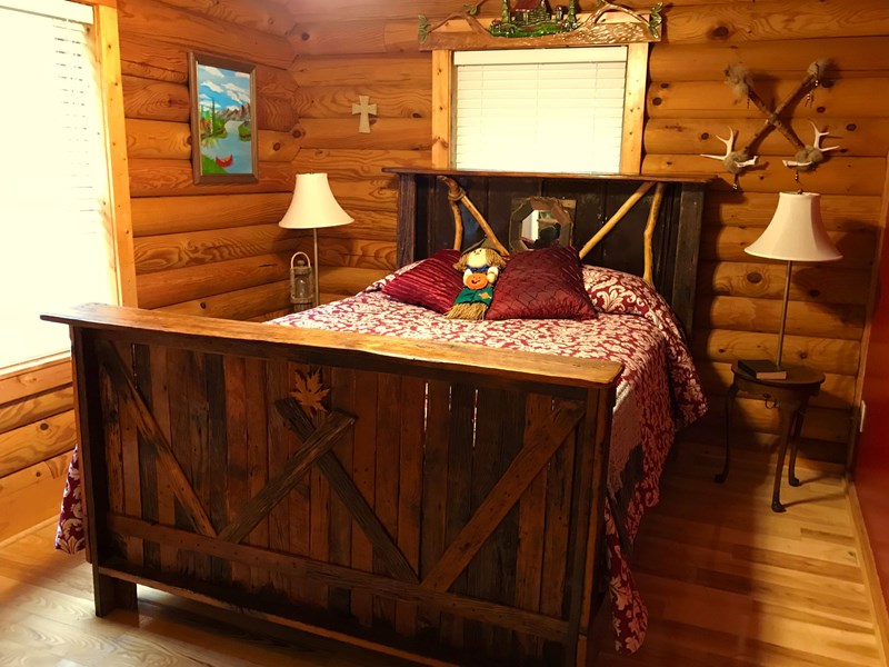 Main level bedroom with barnwood bed
