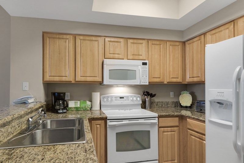 Our kitchen features granite countertops and upscale appliances