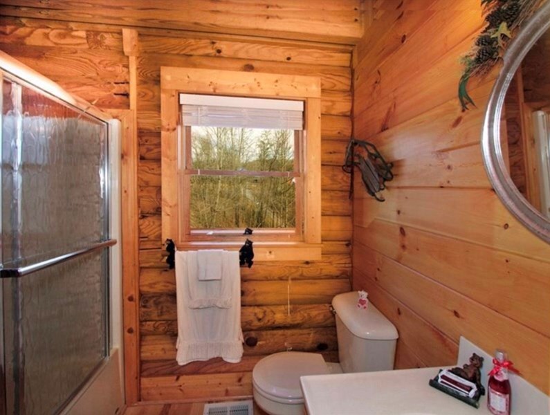 Main level bathroom with tub and shower